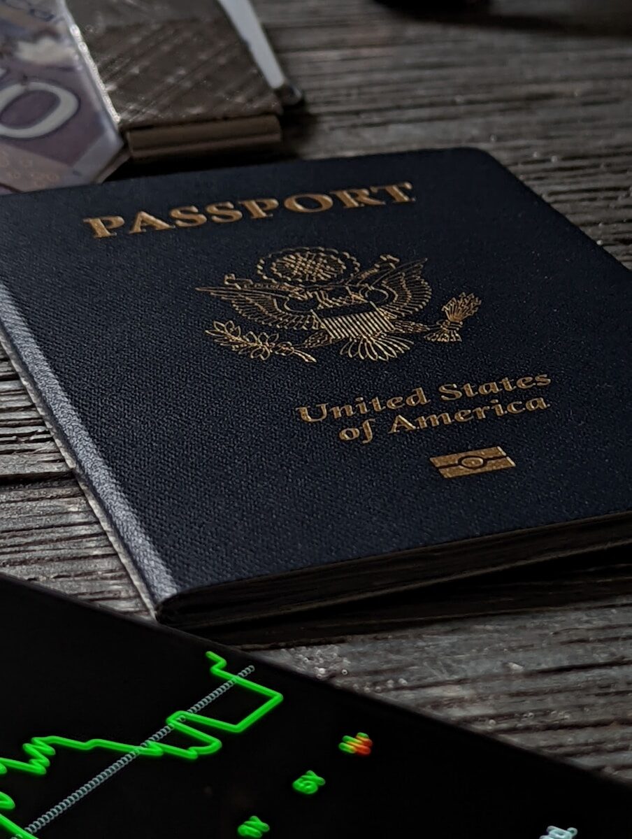 a passport sitting on top of a wooden table
