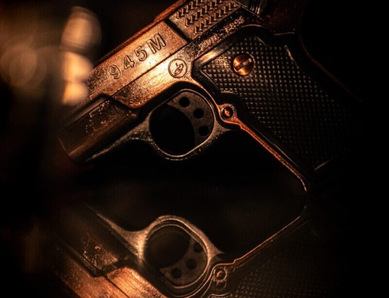 A close up of a gun on a table